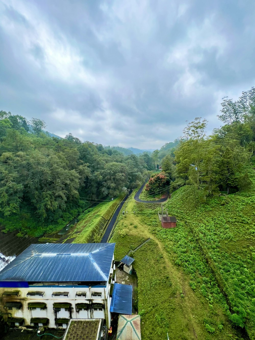 an aerial view of a farm with a train on the tracks