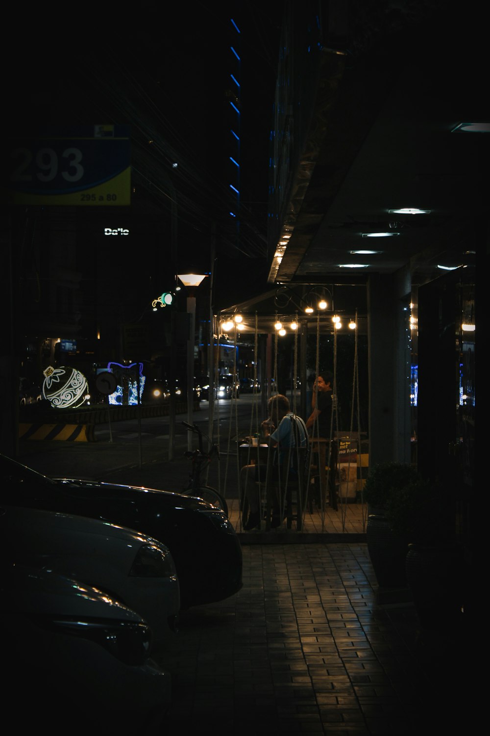 a person sitting at a table at night