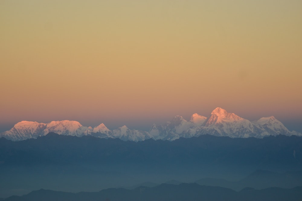 a view of a mountain range at sunset