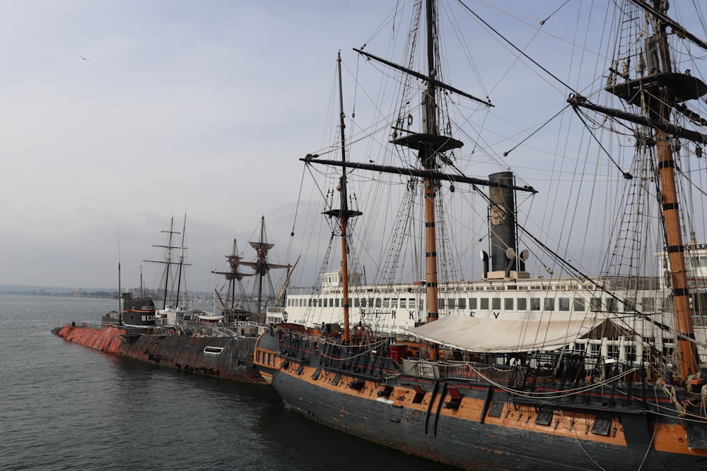 a large ship in the water next to another ship