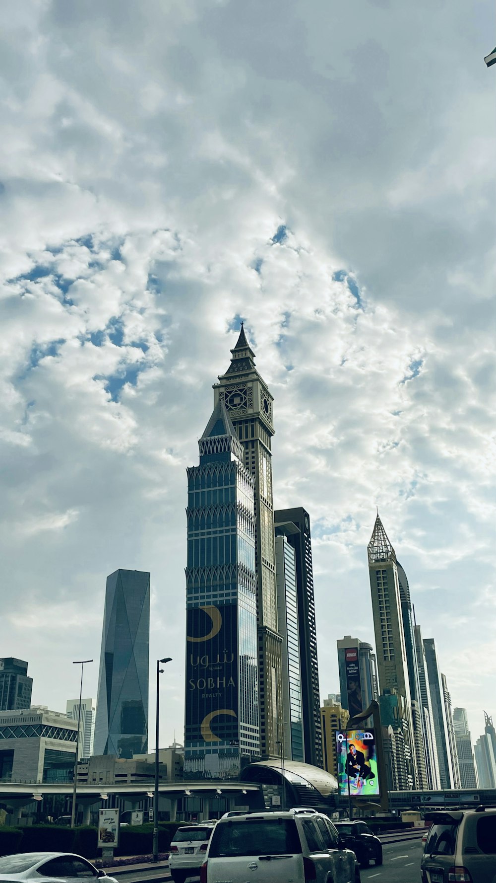 a very tall clock tower towering over a city