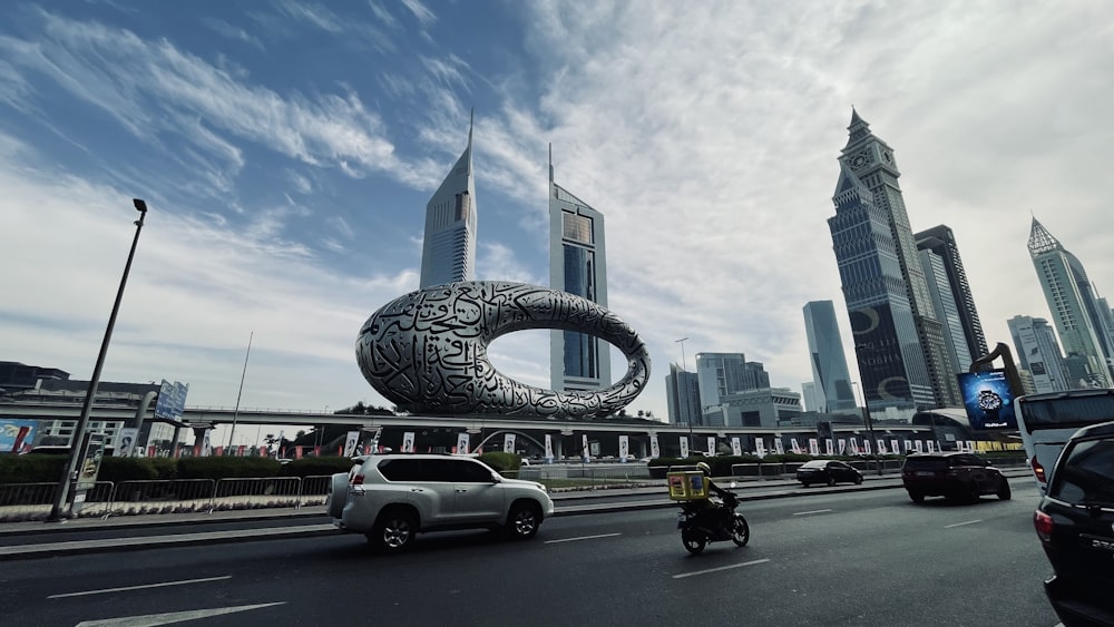 a city street with cars and motorcycles on it