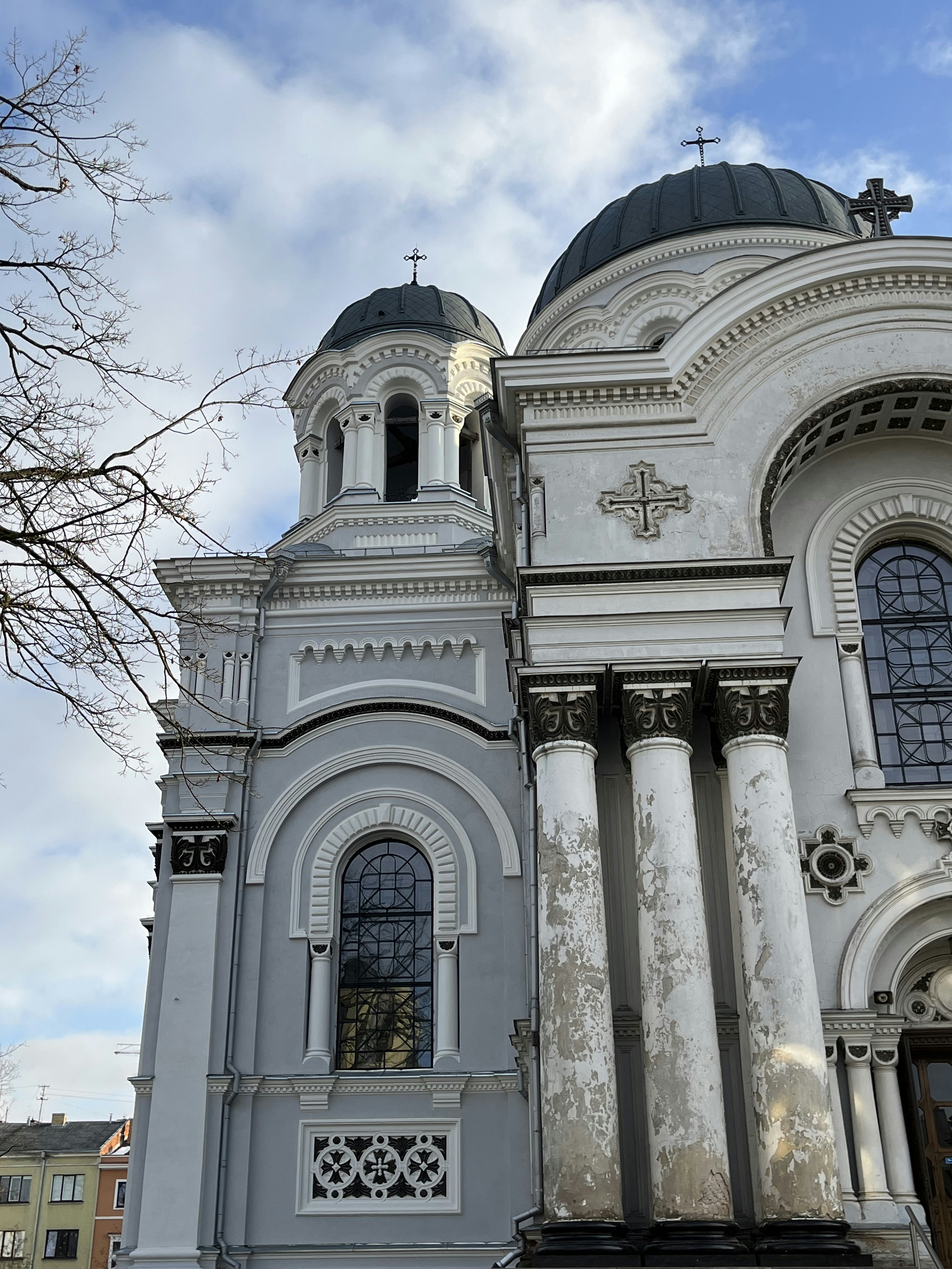 a large white church with a cross on the top of it