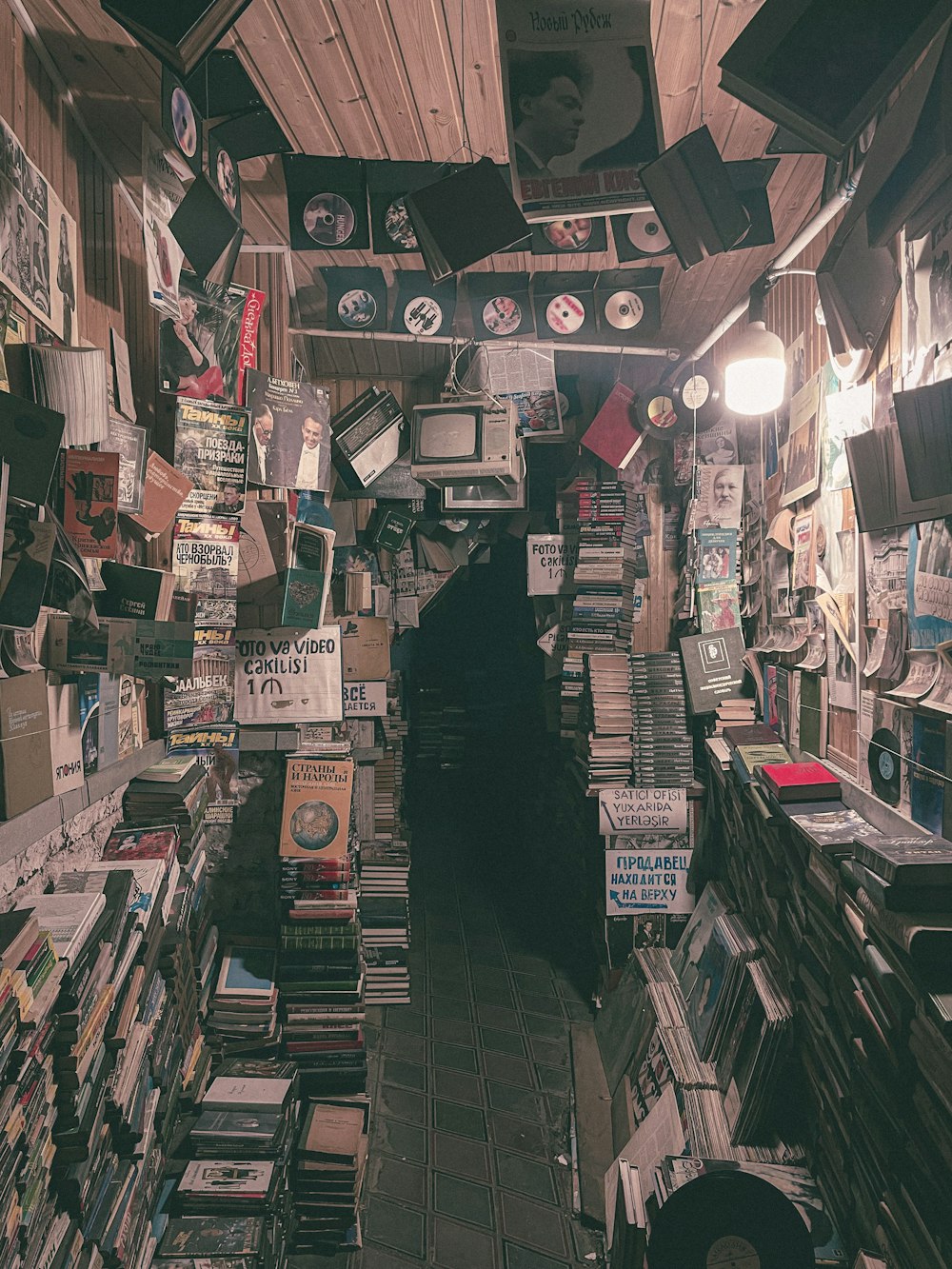 a room filled with lots of books and cds