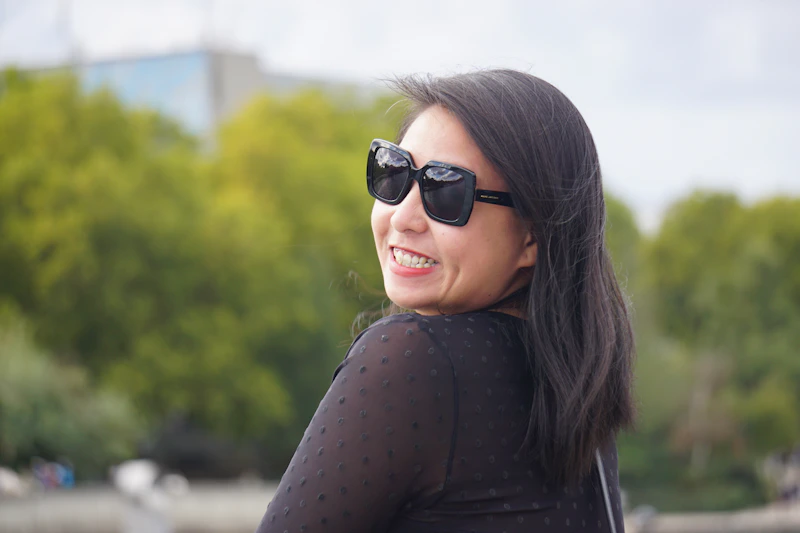 woman in sunglasses and a black top