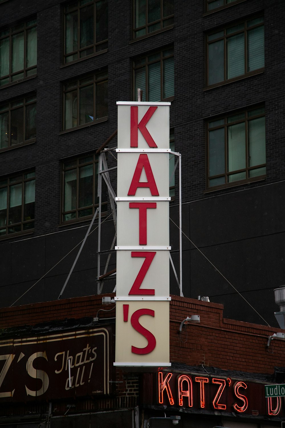 a large sign that says katz's on the side of a building