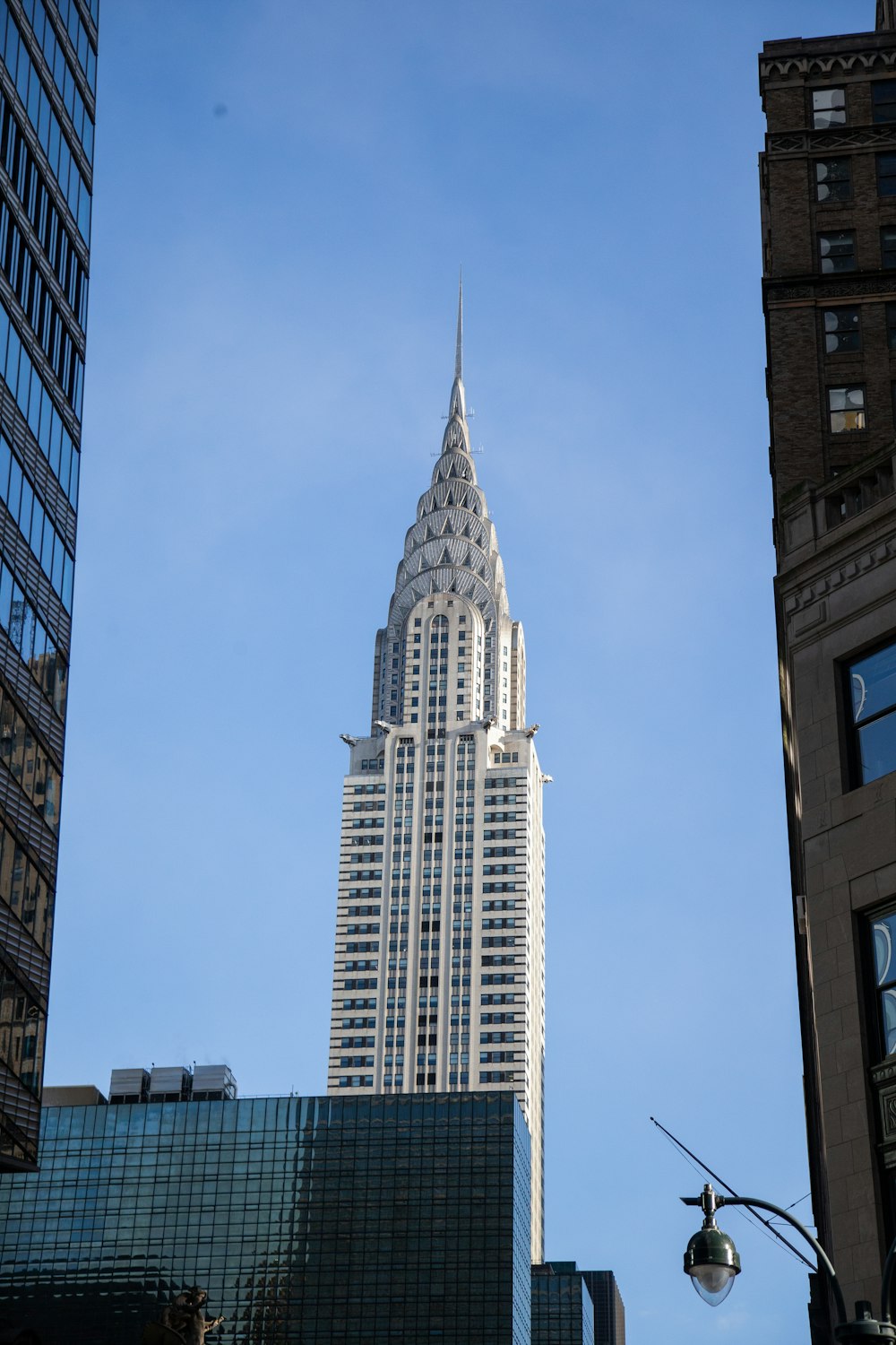 a very tall building towering over a city