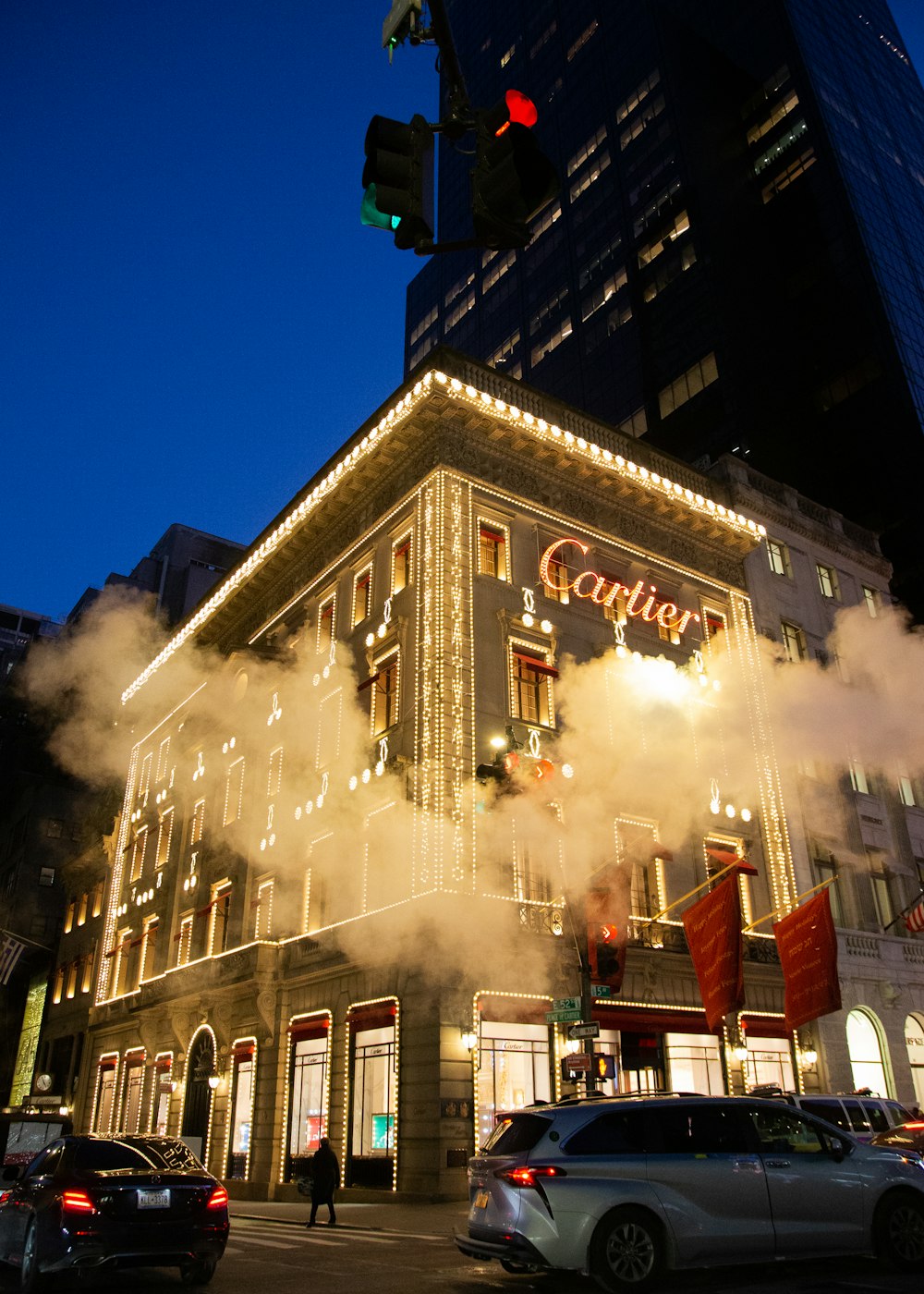 a very tall building with a lot of smoke coming out of it