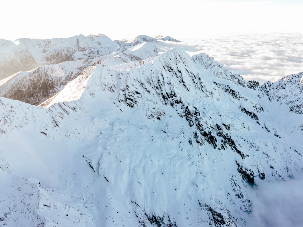 a view of a mountain range covered in snow