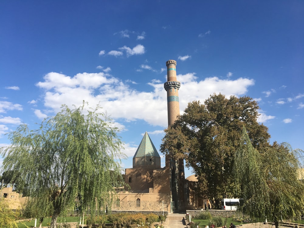 a tall building with a blue and white tower