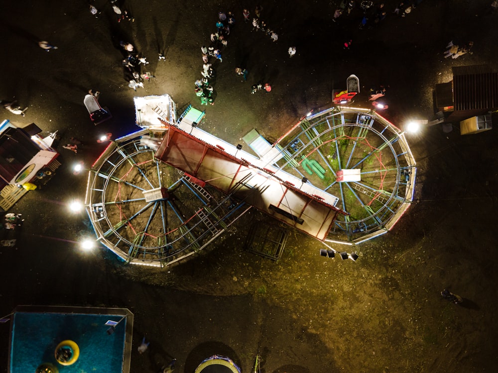an aerial view of a carnival ride at night