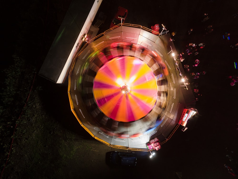 an aerial view of a carnival ride at night