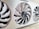 A close-up view of a computer graphics card with three large, white cooling fans enclosed in a metallic casing. The central fan has a visible logo and intricate blade design.