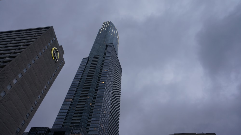 a very tall building with a clock on it's side