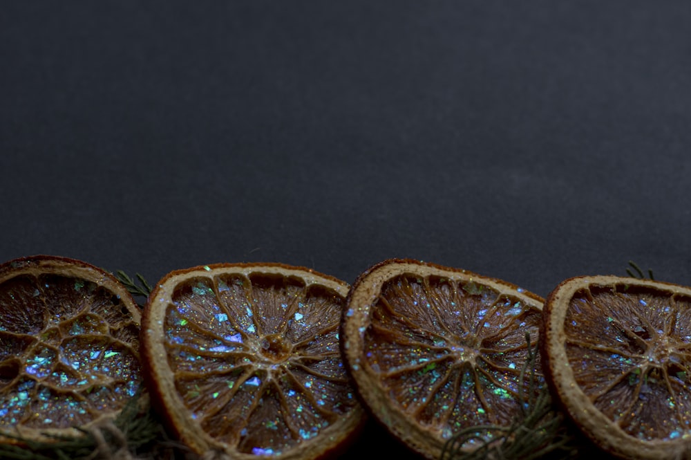 a group of sliced oranges sitting on top of a table