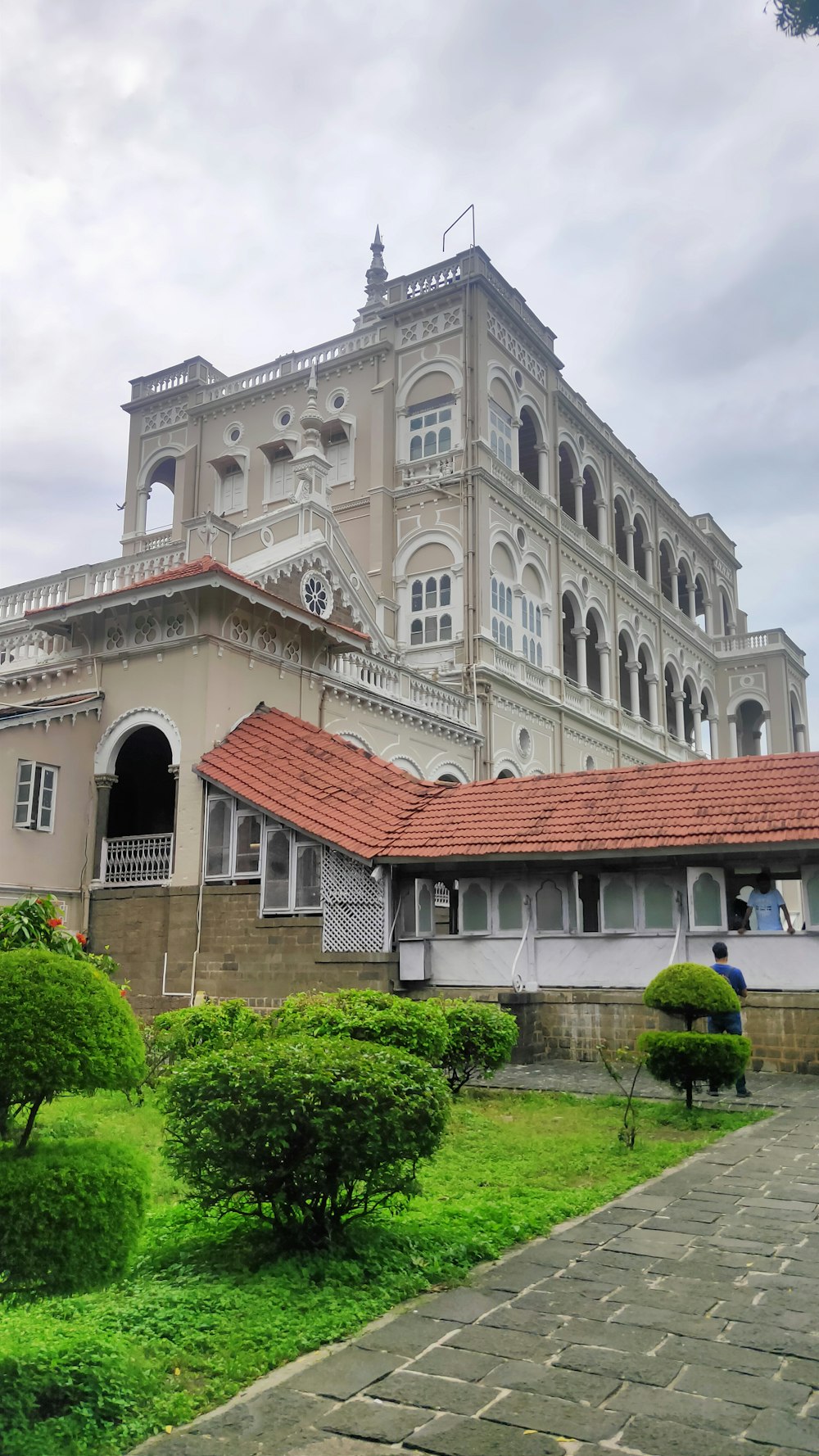 a large white building with a red roof