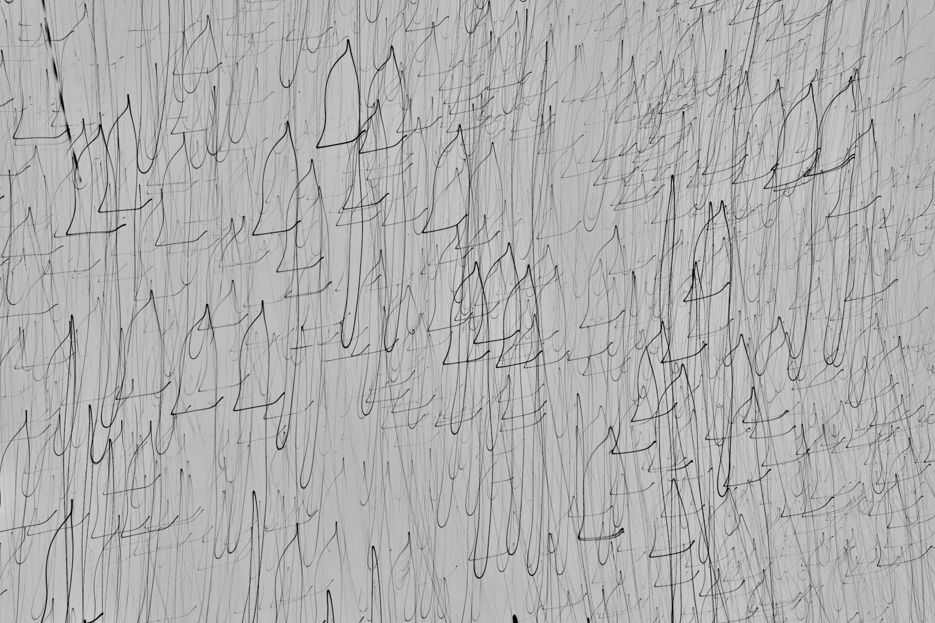 a black and white photo of a rough wall