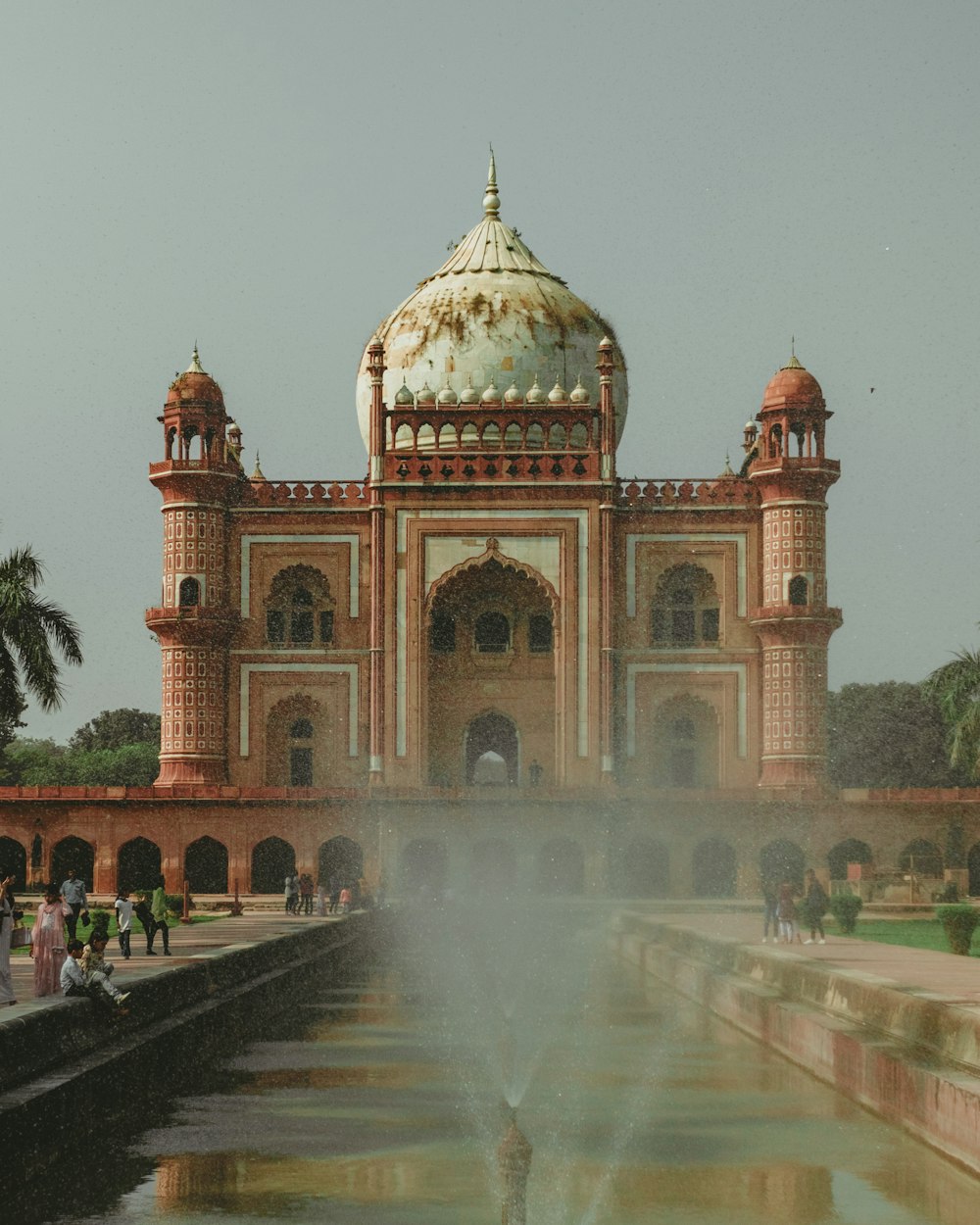 a large building with a fountain in front of it