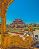 a golden statue in front of a building