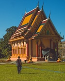 Pilgrims walking towards the temple area amidst festive decorations.