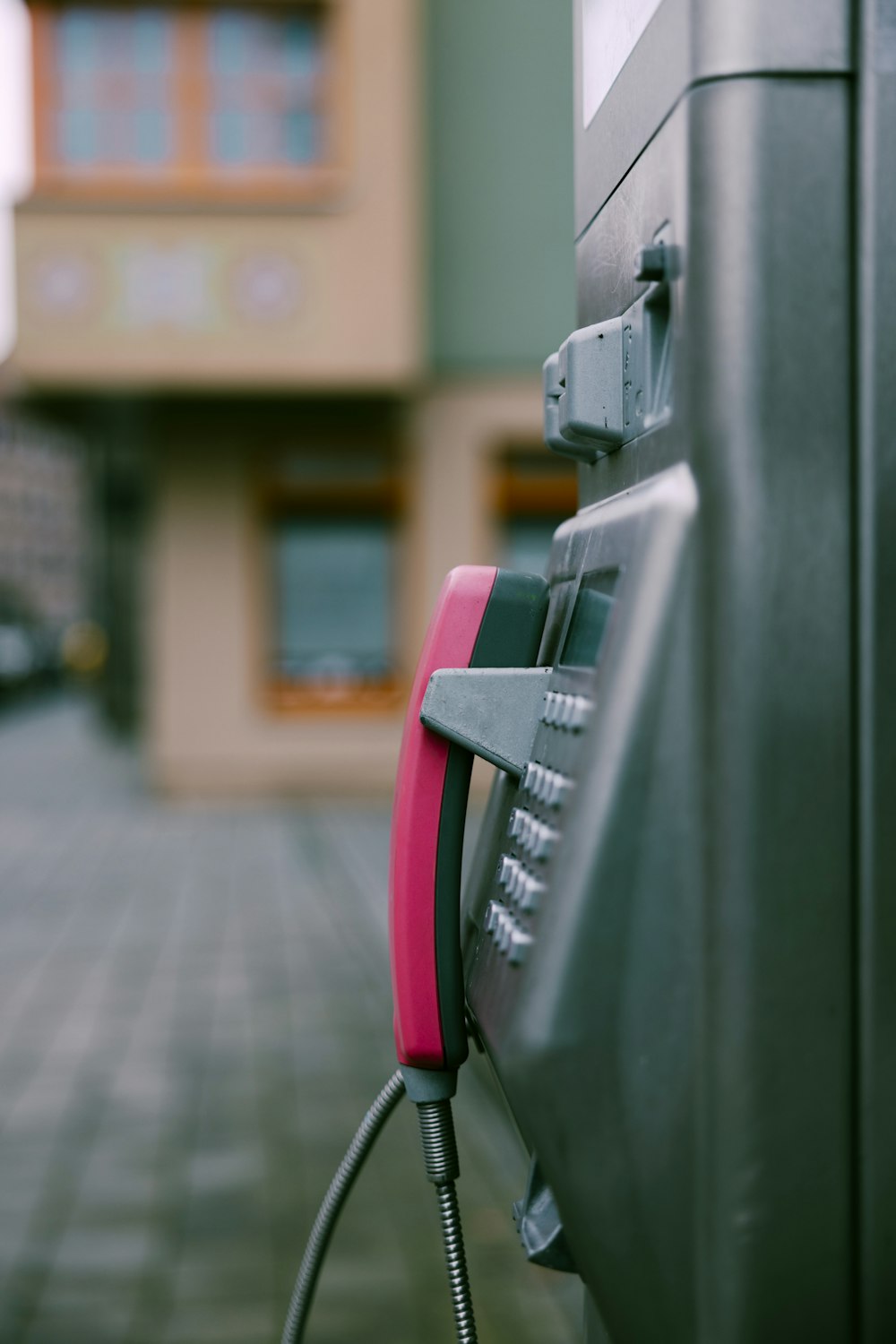 a close up of a gas pump with a building in the background