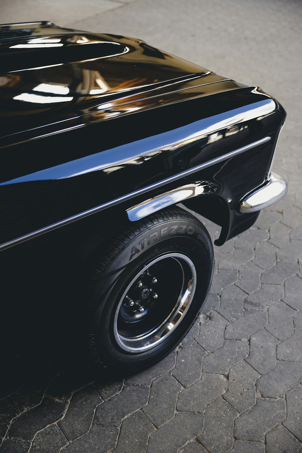 a black car parked on the side of the road