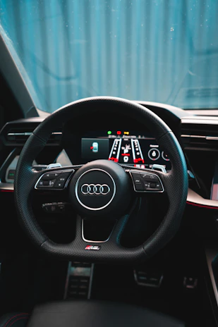 Close-up of a modern car dashboard with digital controls, highlighting comfort and technology.