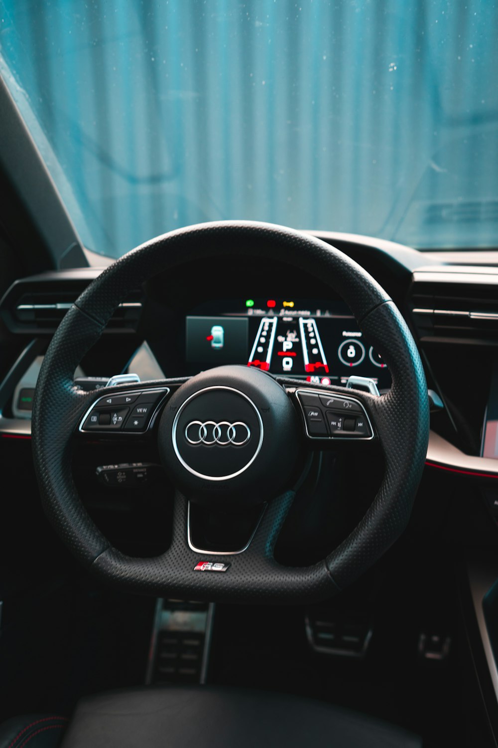 the interior of a car with a steering wheel