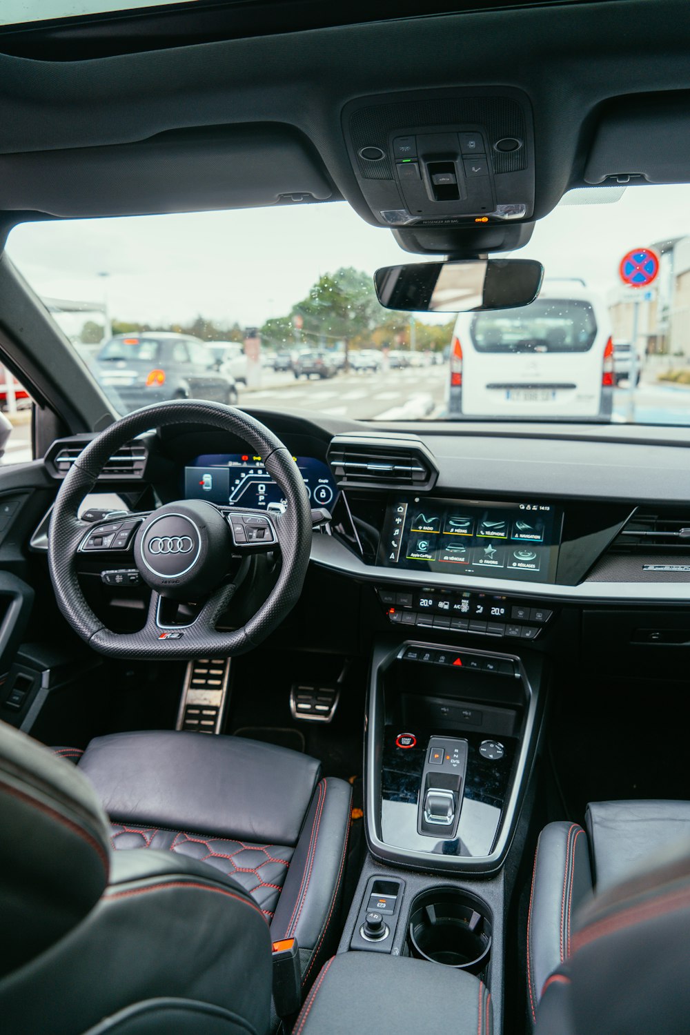 the interior of a car with a dashboard and steering wheel