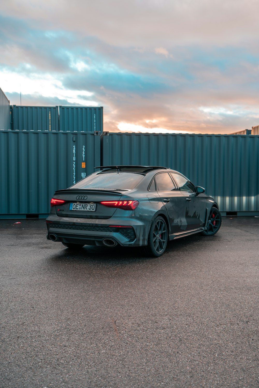 a grey car parked in a parking lot