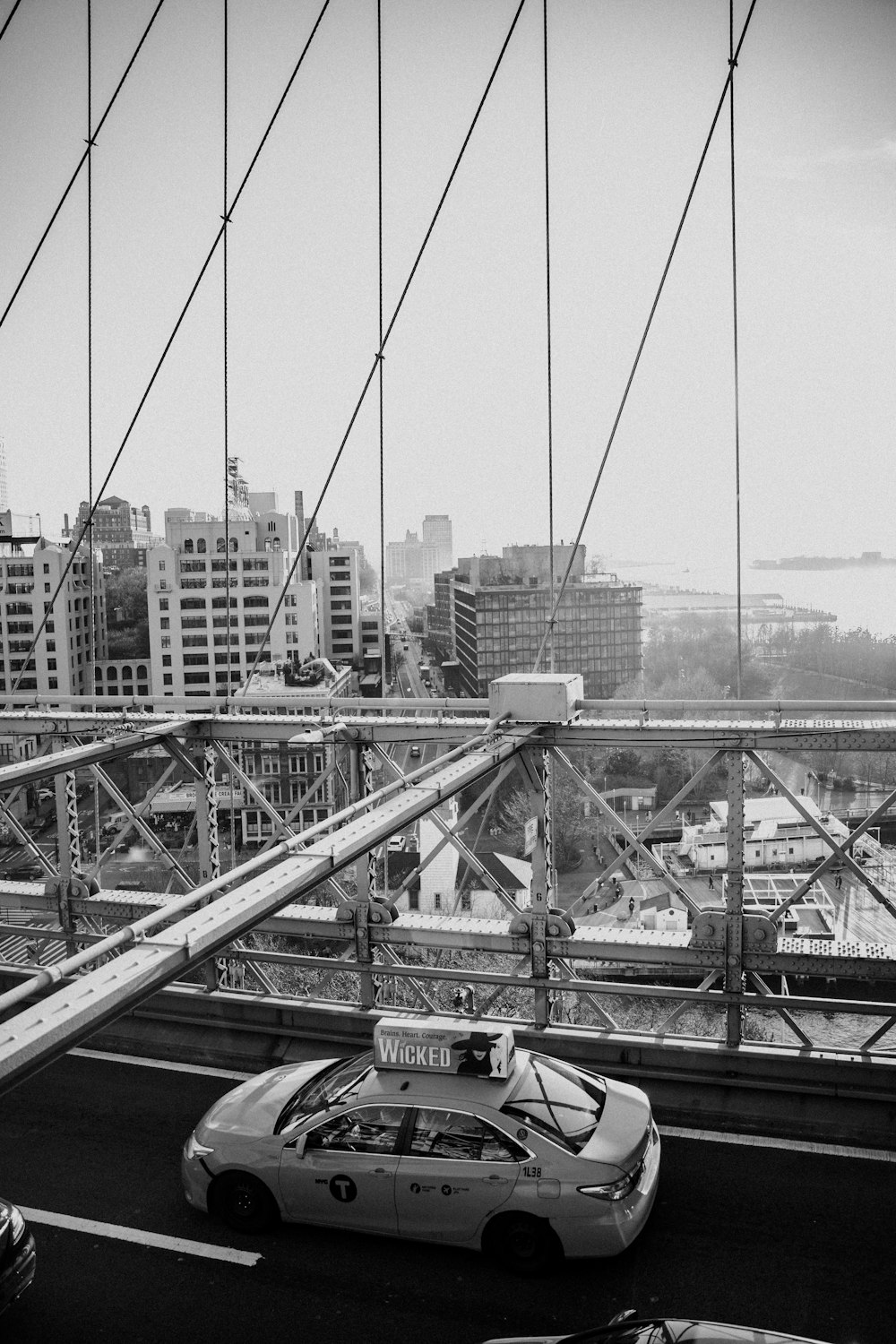 a police car is driving across a bridge