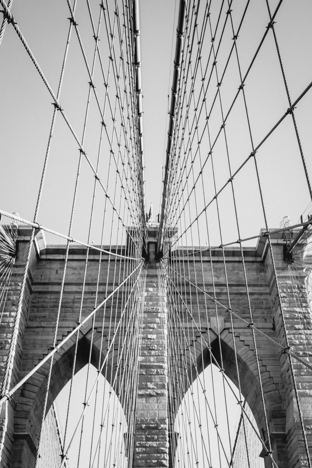 a black and white photo of the brooklyn bridge