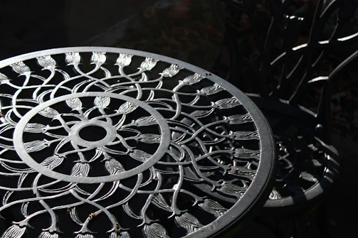 An elegant metal sculpture displayed on a sleek console table, catching the afternoon sunlight.