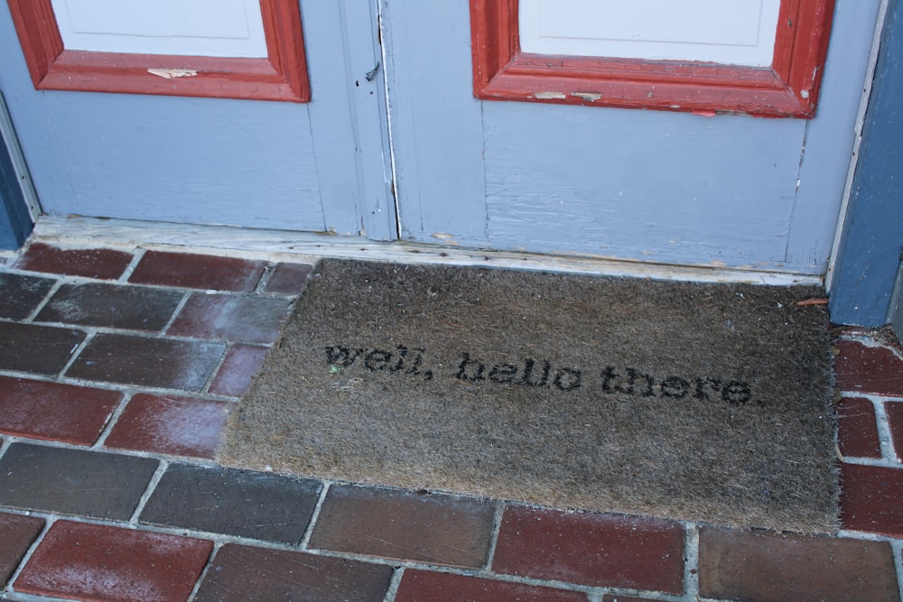 a door mat that says well, hello there