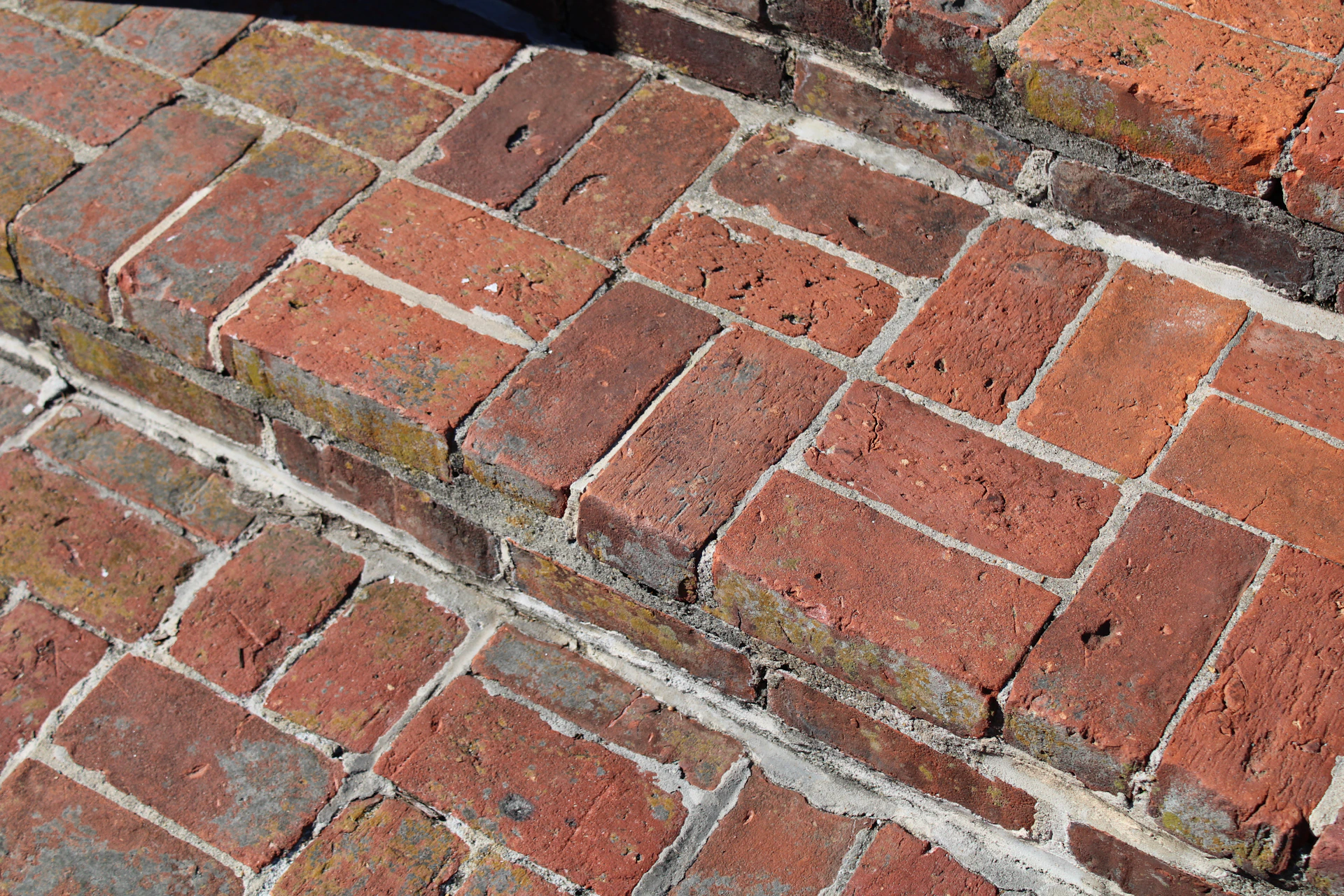 a close up of a red brick wall