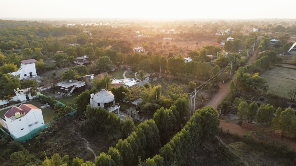 a bird's eye view of a small village surrounded by trees