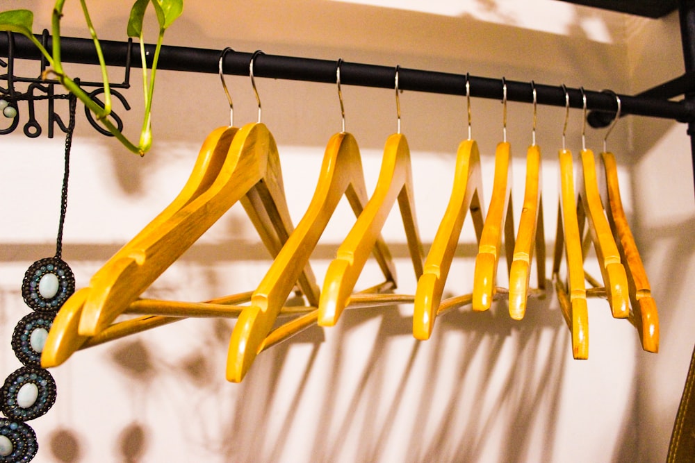 a rack of clothes hanging on a wall