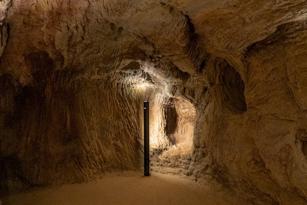 a narrow tunnel with a light at the end