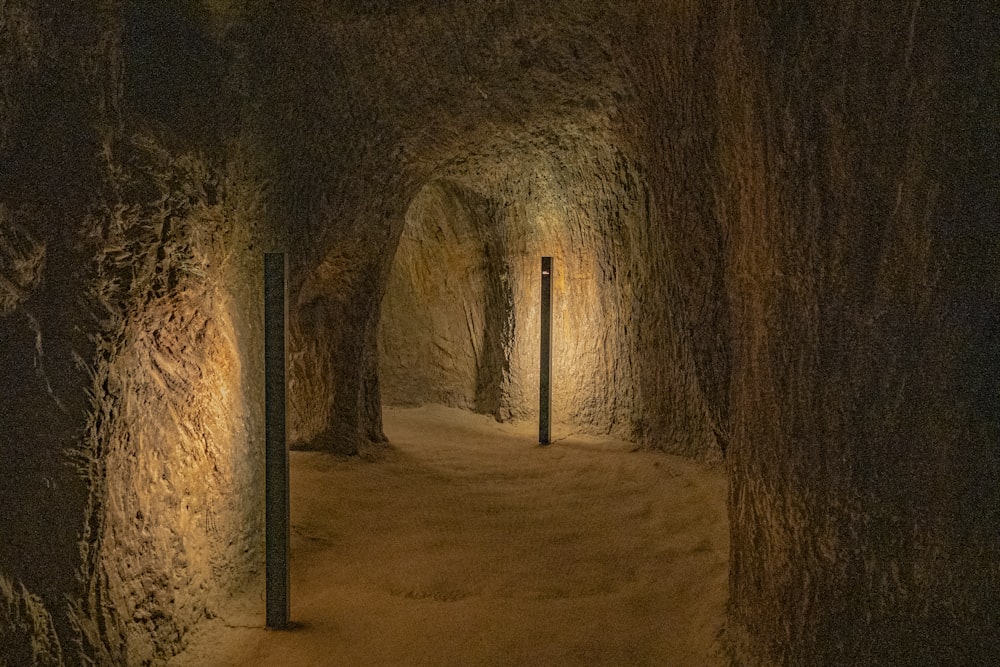 a dimly lit tunnel with a light at the end