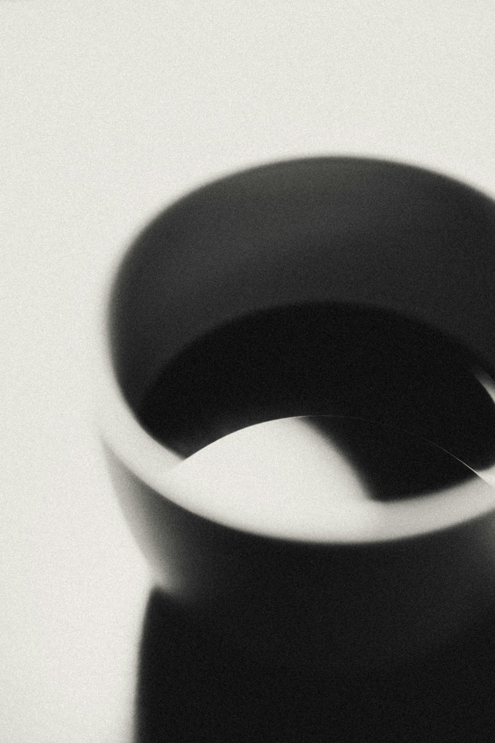 a black and white photo of a ring