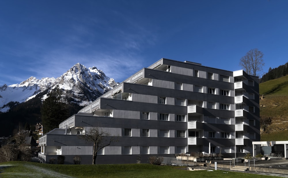 a building with a mountain in the background
