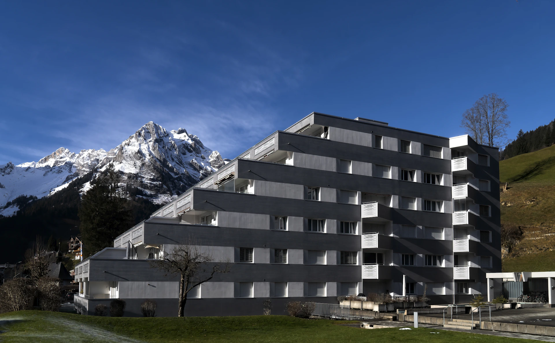 a building with a mountain in the background