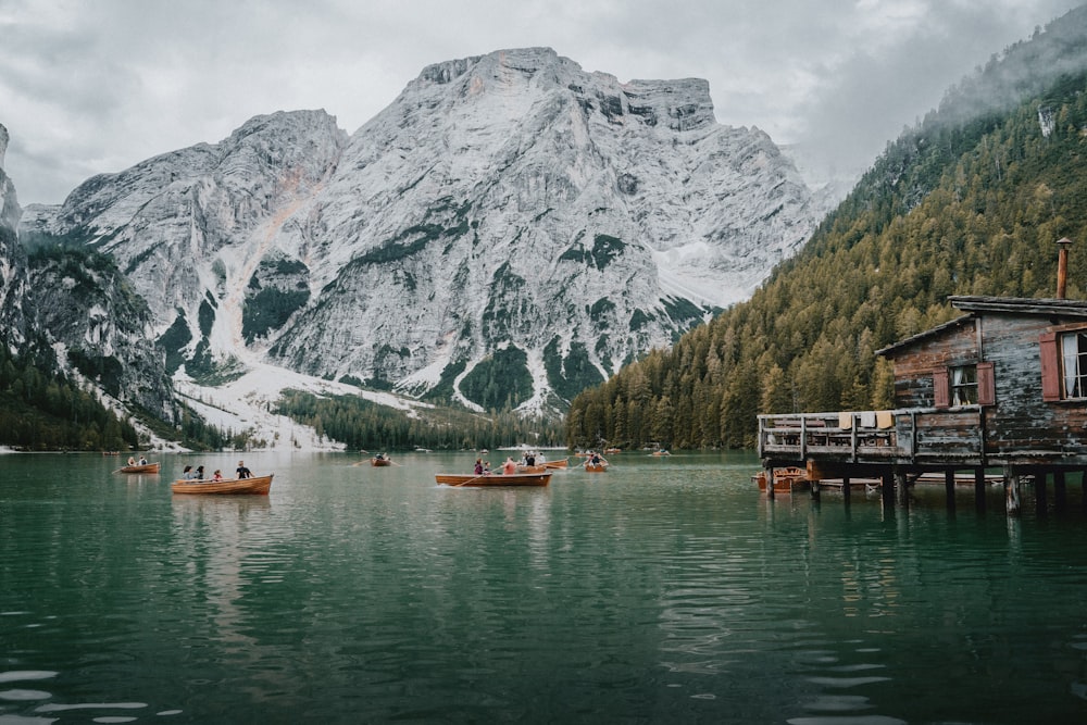 a group of boats floating on top of a lake