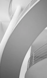 Grayscale image of a sleek, stylish commercial space with clean lines and minimalist furniture.