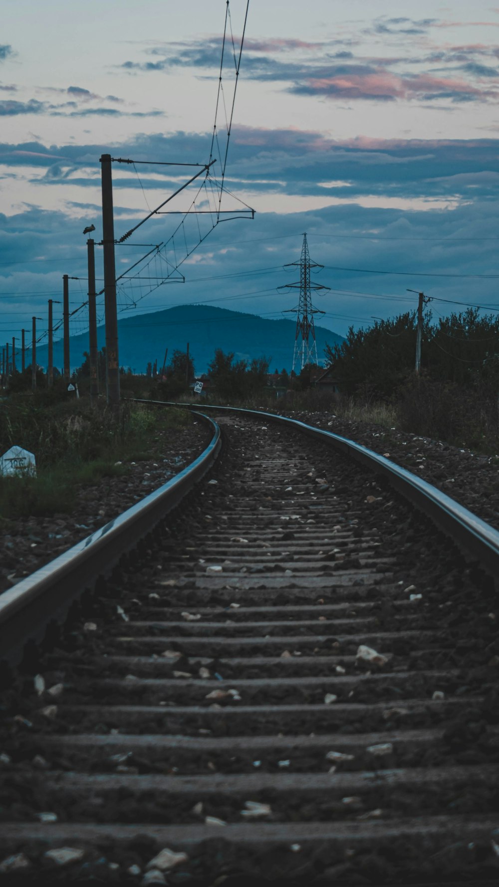 a train track with a sky in the background