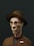 A stylized, digital 3D rendering of a character with a long, angular face wearing round glasses and a brown, striped hat. The character is dressed in a brown textured jacket with a visible name tag reading 'OSCORR'. The background is a solid, dark green, creating a strong contrast with the character's lighter complexion.