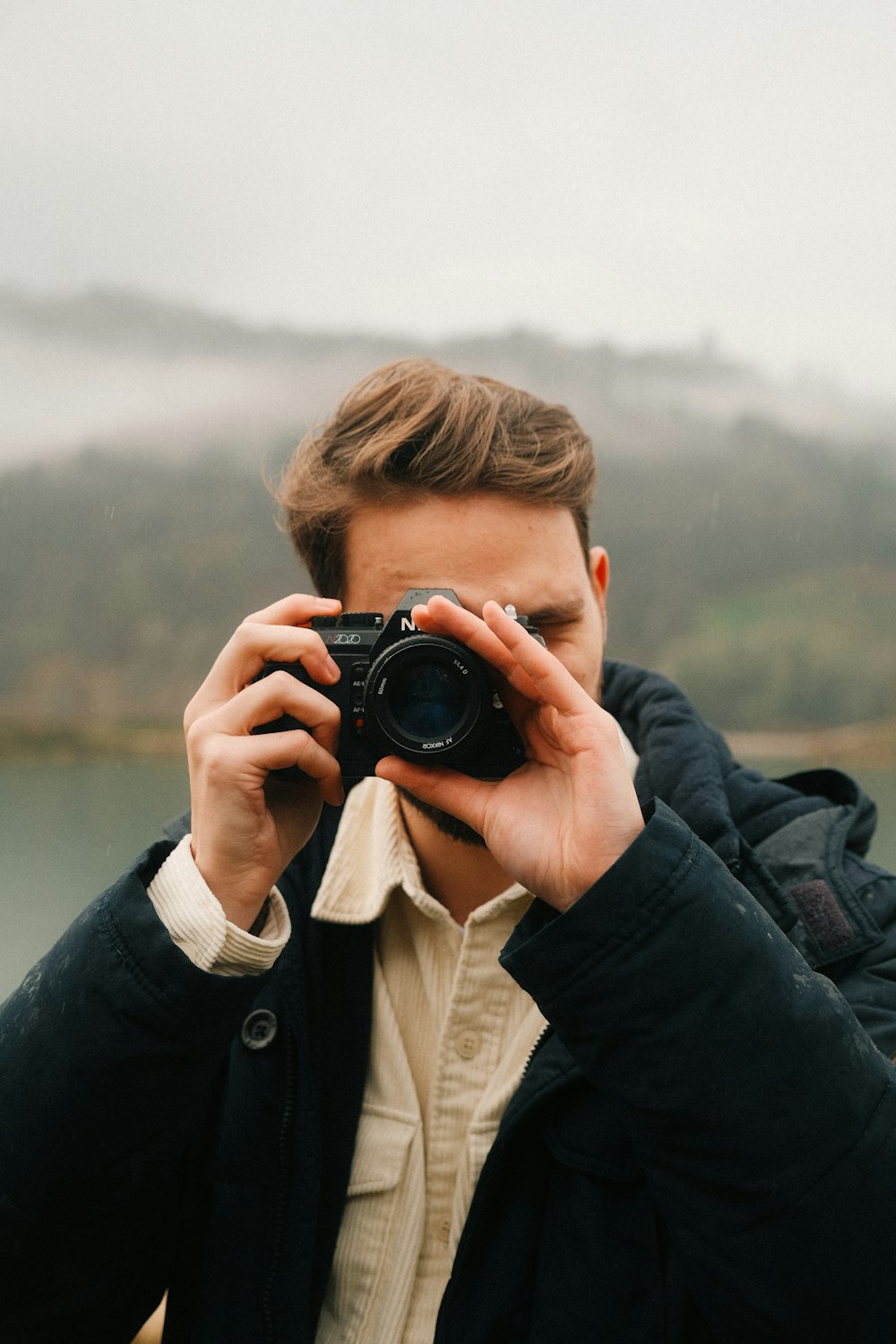 a man taking a picture with a camera