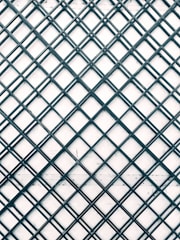 a black and white photo of a metal grid