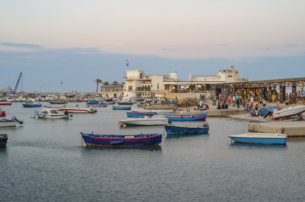 a group of boats floating on top of a body of water