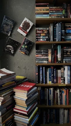 A cozy reading corner with stacks of diverse books published by elgos citapublisher
